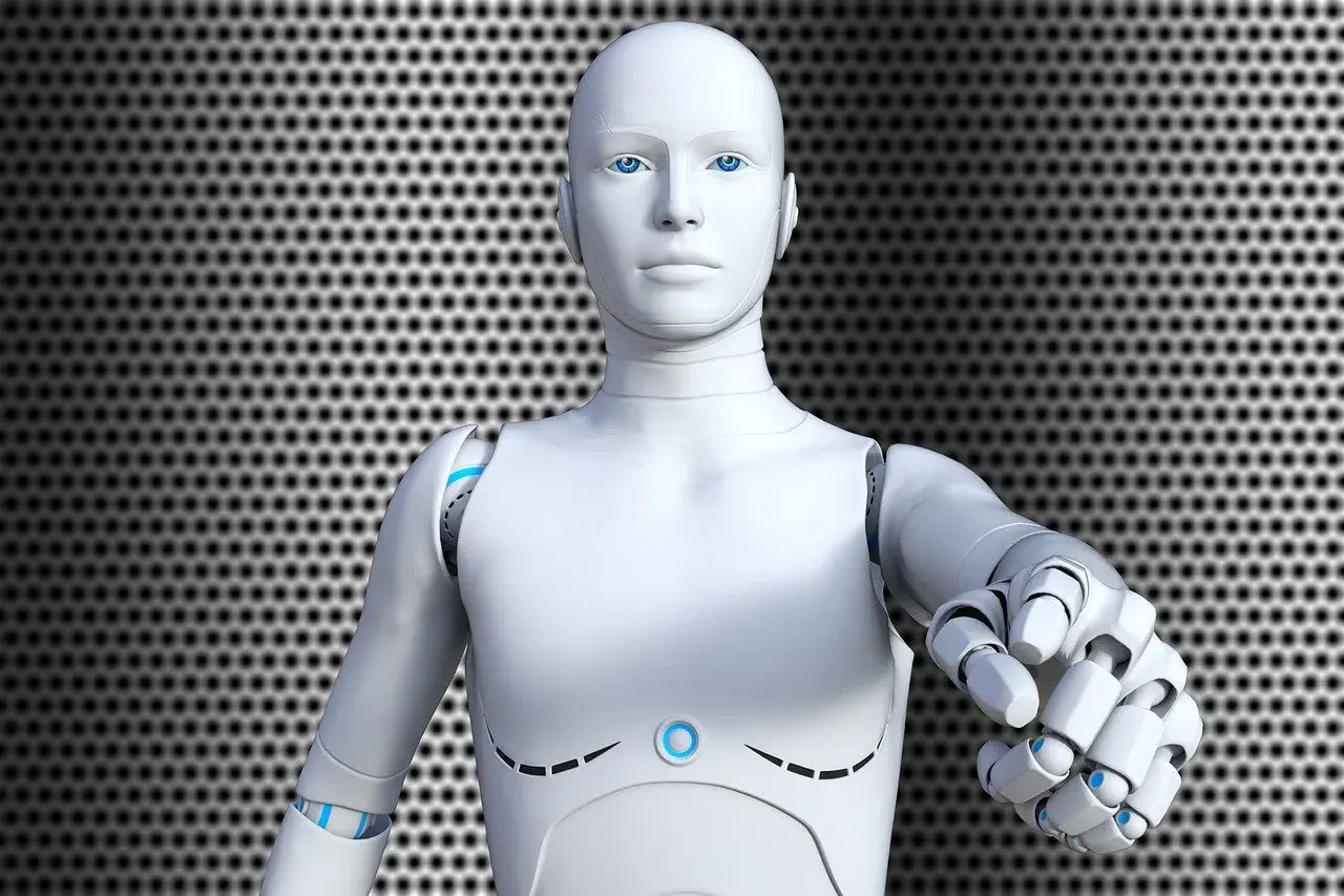 Biały robot z niebieskimi oczami wyciąga dłoń. Czy to przyszłość, co to jest ros?