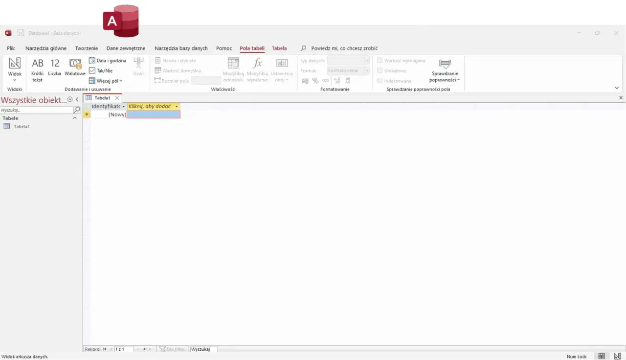Interfejs programu Microsoft Access do tworzenia i edycji **bazy danych access**. Widoczna jest tabela "Tabela1" z polem "Identyfikator".